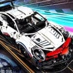 Detailed LEGO Porsche 911 RSR sports car brick model for display.