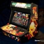 Compact arcade gaming machine with vibrant character artwork and multiple game options.